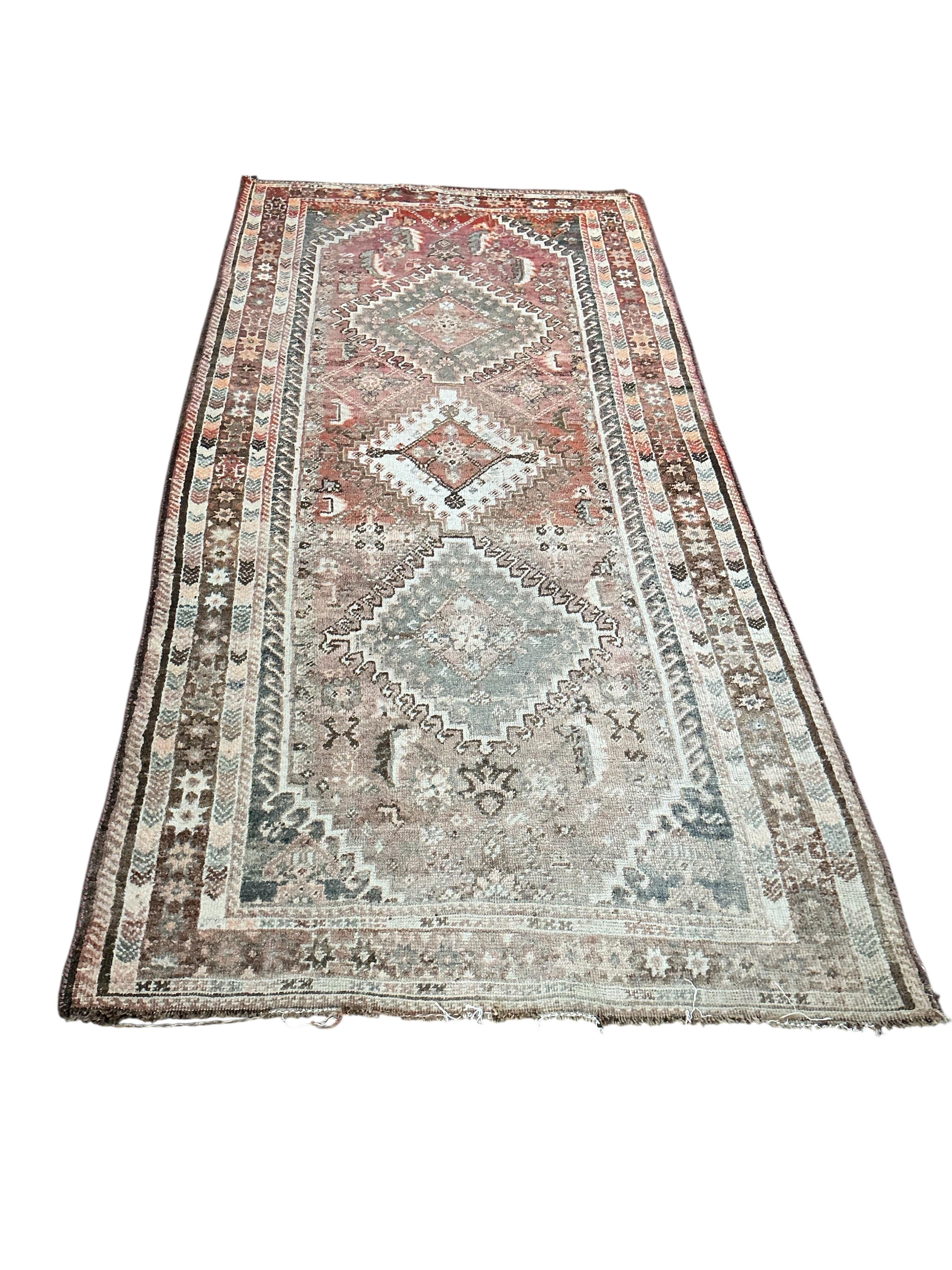 A Hamadan red ground rug, some sun fading, 220 x 105cm